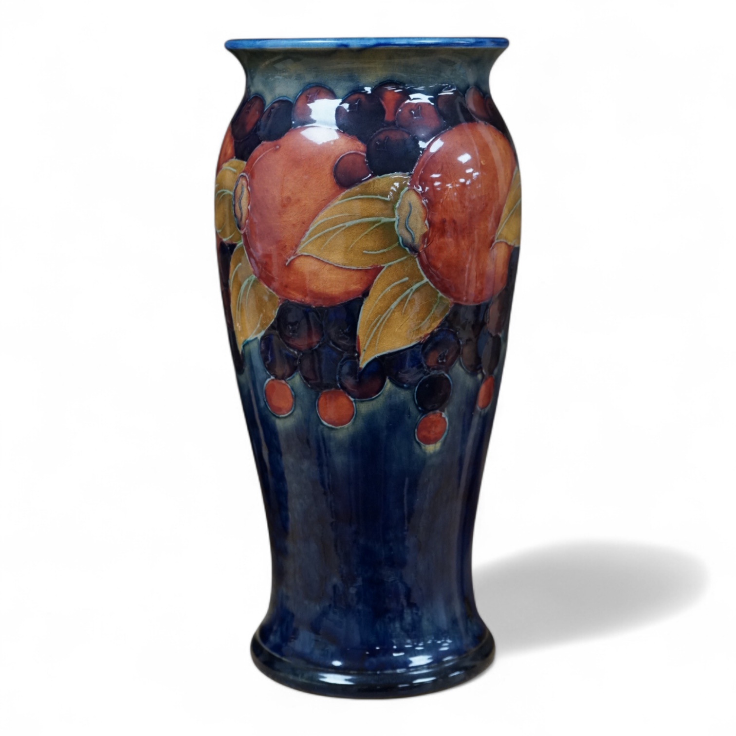 A Moorcroft Pomegranate vase, 26cm high. Condition - good, minor crazing